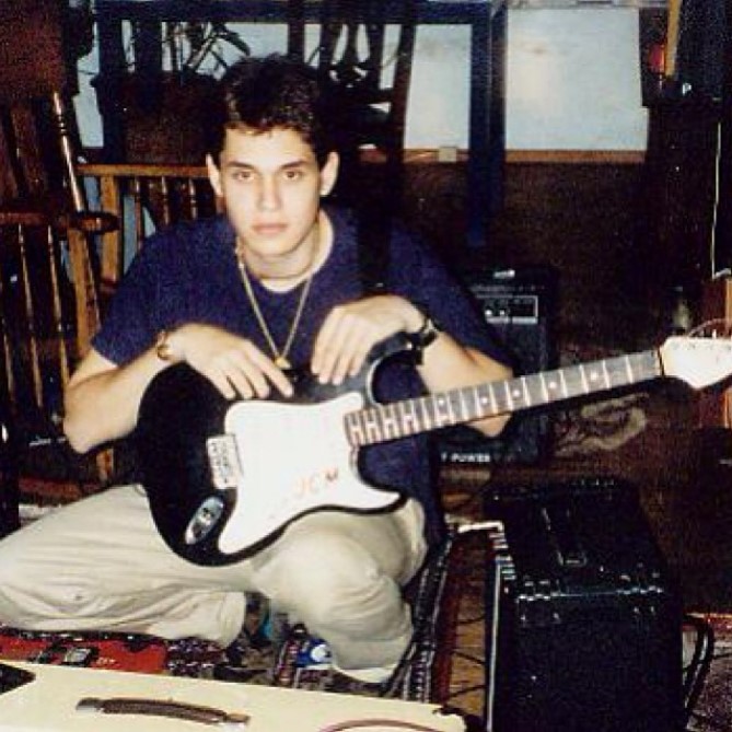 John-Mayer-holding-a-1990s-Squier-Stratocaster.jpg