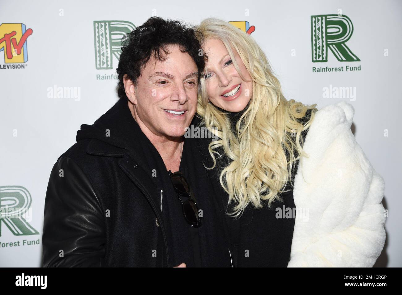 musician-neal-schon-and-wife-michaele-schon-arrive-at-the-30th-anniversary-rainforest-fund-benefit-concert-at-the-beacon-theatre-on-monday-dec-9-2019-in-new-york-photo-by-evan-agostiniinvisionap-2MHCRGP.jpg